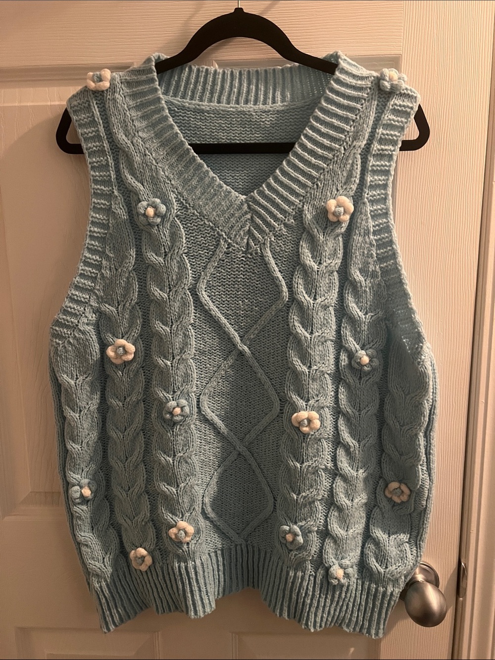 Light blue with flower details knitted vest